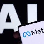 Meta logo seen on smartphone and AI letters on the background. Concept for Meta Facebook Artificial Intelligence. Stafford, UK, May 2, 2023